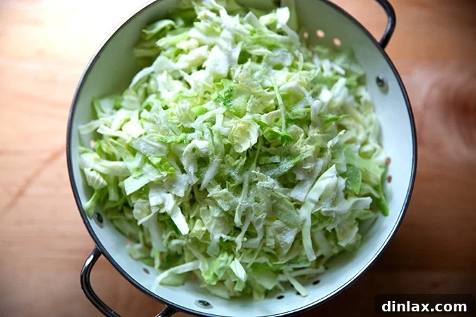 Five Ingredient Baked Cabbage Tortillas Gluten Free 5 Salted cabbage in a colander.