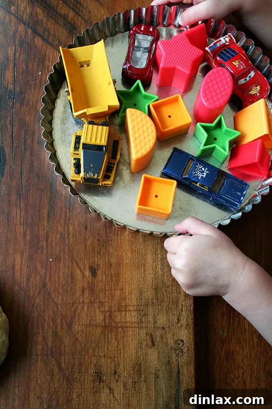 Ella's adorable tart pan, ready for baking adventures. A small, decorative tart pan, hinting at a playful culinary adventure, likely Ella's tart pan, ready for its next baking project.