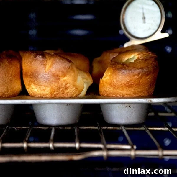 A tray of popovers in the oven.