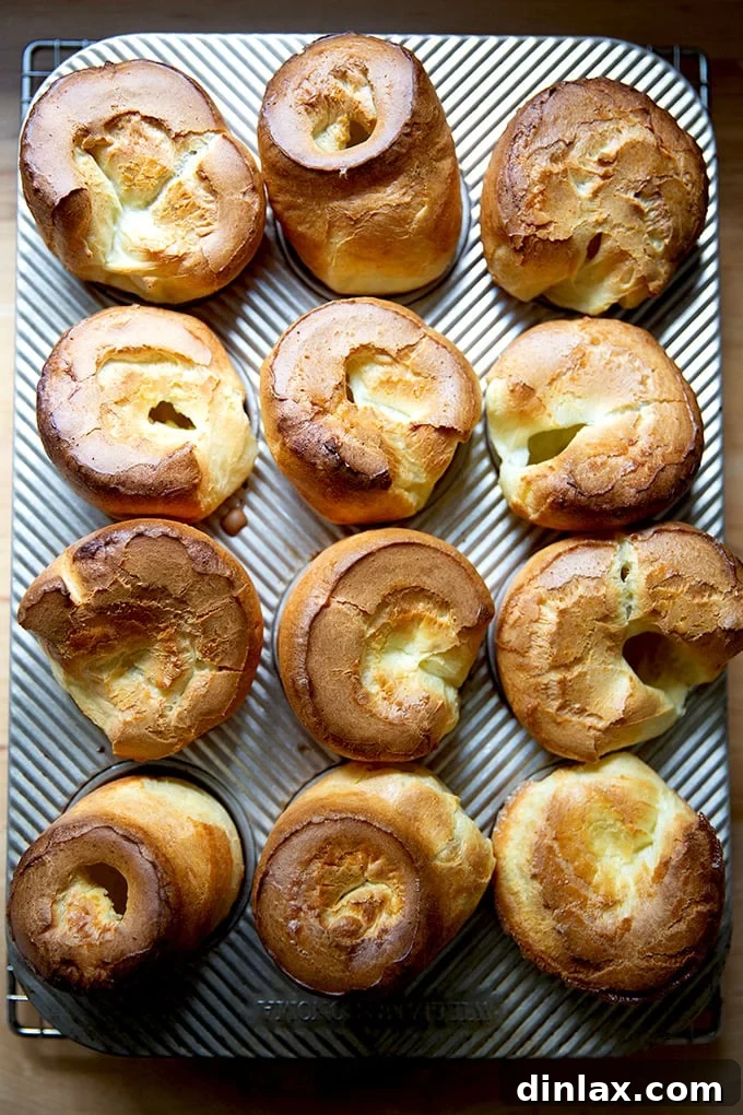 Freshly baked popovers still in their muffin tin, just out of the oven.