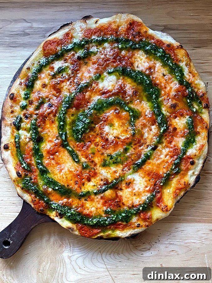 Homemade Rubirosa style tie-dye pizza with vibrant sauces