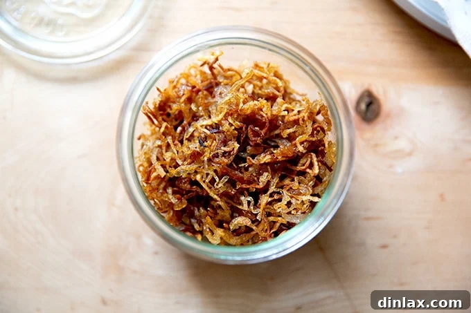 Golden Roasted Green Beans with Sweet Shallot Glaze 13 A jar filled with crispy fried shallots.