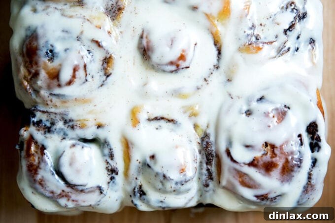 A Grand Christmas Spread: Ham, Classic Sides, and Decadent Desserts 2 Frosted cinnamon brioche buns, a delightful start to Christmas morning.