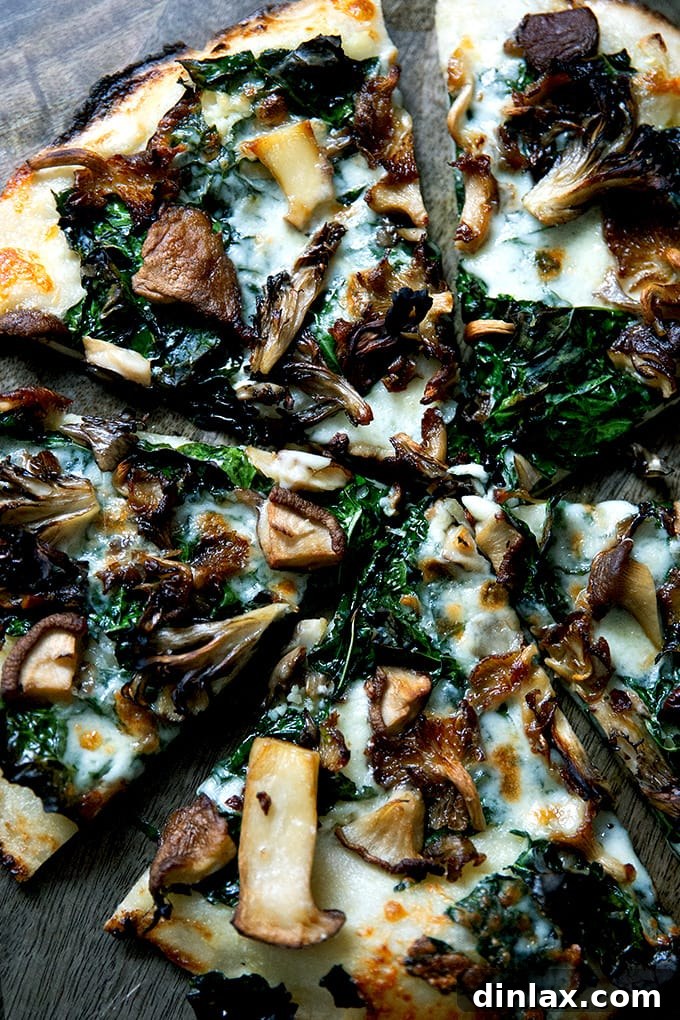 A gourmet gluten-free pizza topped with roasted wild mushrooms, kale, and crème fraîche.