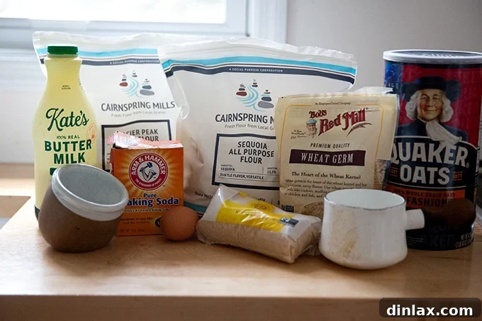 All the dry and wet ingredients for Irish brown bread meticulously laid out on a kitchen countertop, ready for preparation.