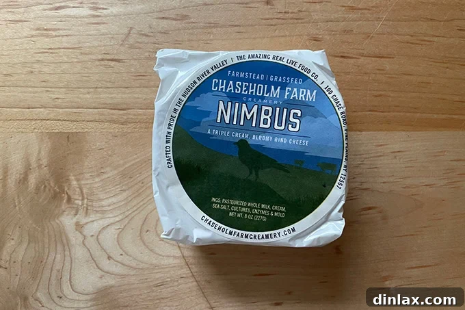Perfect Gifts for Mom 19 A wheel of Nimbus artisan cheese, with a creamy interior.
