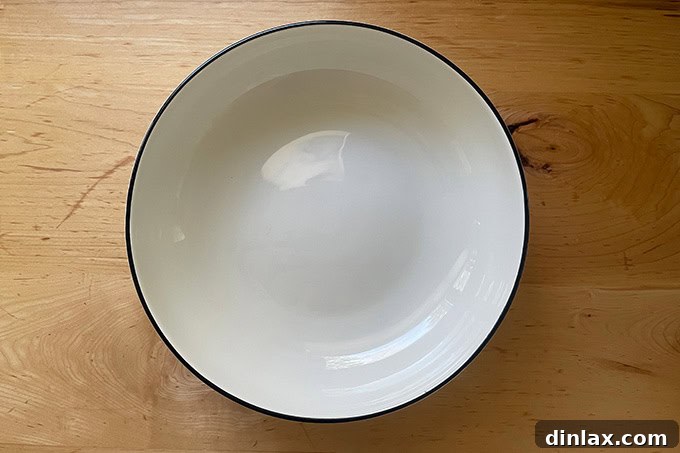 Perfect Gifts for Mom 20 A stylish Made In serving bowl with a navy rim.