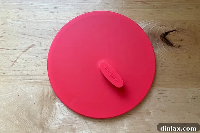 Perfect Gifts for Mom 24 Two Made In universal silicone lids in different colors.