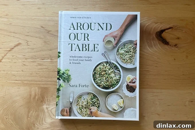Perfect Gifts for Mom 6 Cover of 'Around Our Table' cookbook by Sara Forte, displaying a comforting family meal.