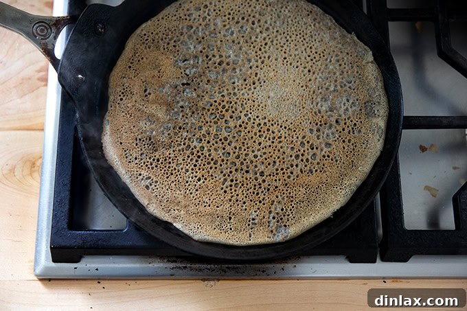 Light and Delicate Gluten Free Buckwheat Crepes 11 A perfectly cooked buckwheat crepe in a nonstick skillet, having been flipped and lightly browned on both sides.