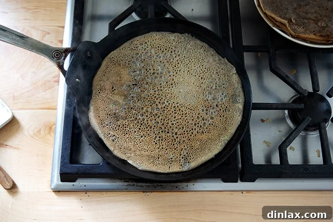 Light and Delicate Gluten Free Buckwheat Crepes 12 Another beautifully cooked buckwheat crepe in a nonstick skillet, showcasing the consistent quality achievable with the recipe.