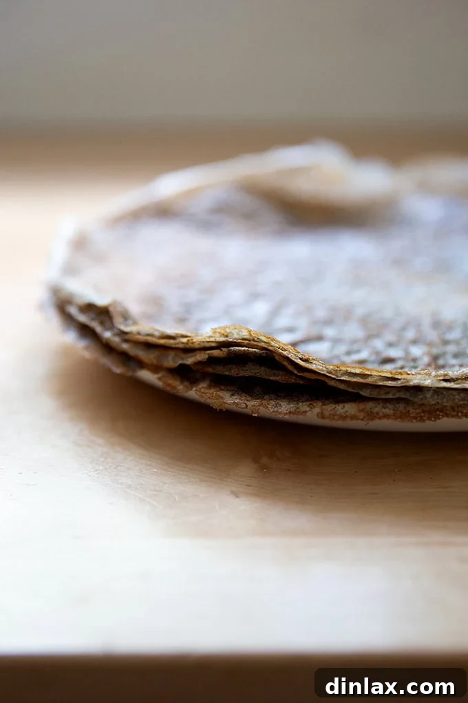 Light and Delicate Gluten Free Buckwheat Crepes 15 A stack of paper-thin cooked buckwheat crepes, ready for filling or storage, showcasing their perfect texture.