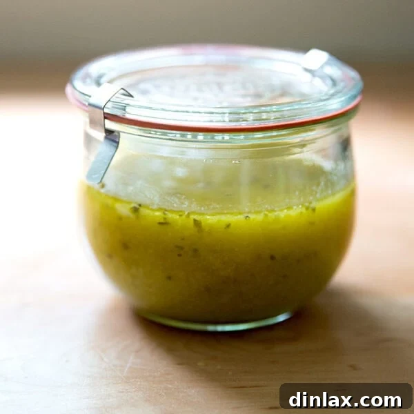 A Weck jar filled with homemade Italian dressing, glistening and ready for use.
