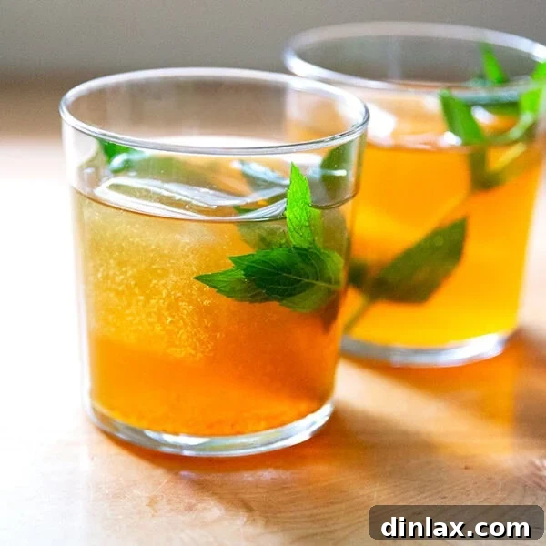 Two glasses of perfectly chilled iced tea, ready to be enjoyed.