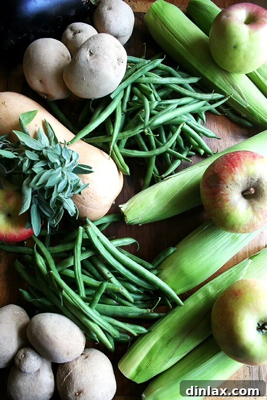 Maximize Your CSA Box: Two Delicious Potato Recipes Inside 3 CSA produce share roughly divided into meal-sized portions on a counter.