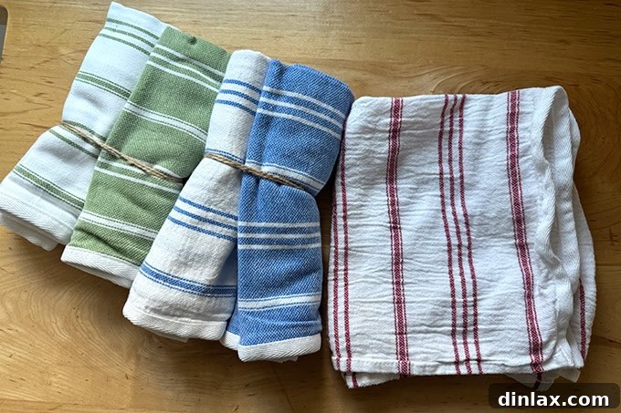 Festive Gift Ideas 2024 35 Dish towels on a countertop.