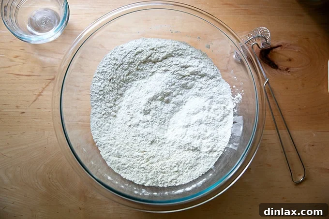 The dry ingredients for baguette dough, thoroughly whisked together in a bowl.