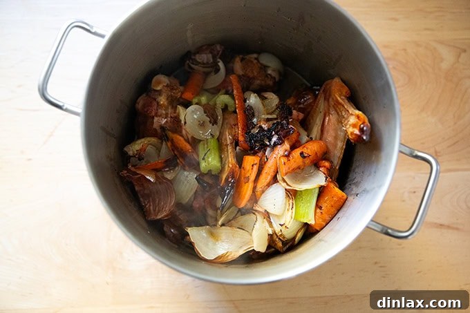Make Ahead Roasted Turkey Wing Stock 12 The stockpot now contains roasted turkey wings, vegetables, and the deglazed liquid from the roasting pan, forming a rich base.