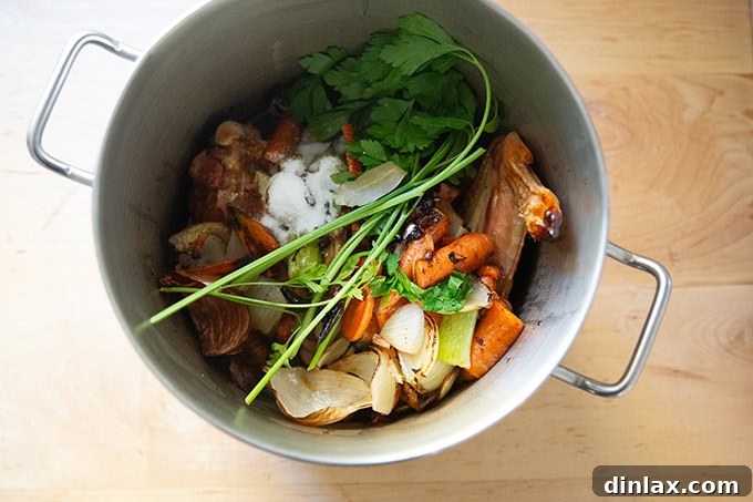 Make Ahead Roasted Turkey Wing Stock 13 All the essential ingredients for turkey stock — roasted turkey, vegetables, deglazing liquid, and herbs — gathered in a large pot.