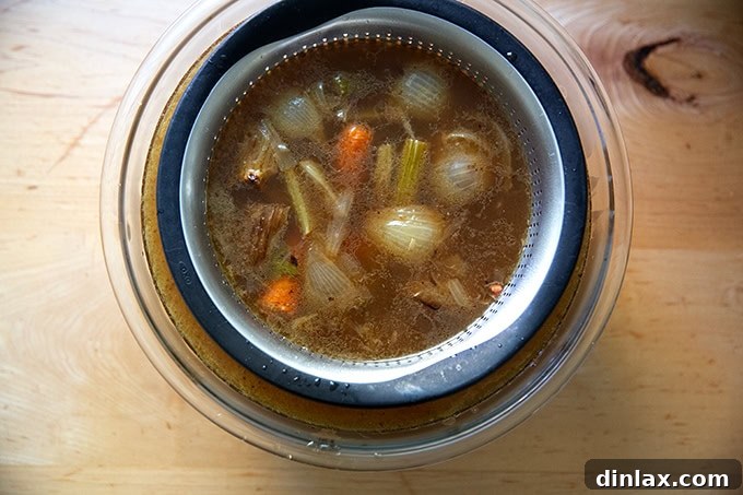 Make Ahead Roasted Turkey Wing Stock 17 A bowl of freshly strained, clear turkey stock, ready for cooling and storage.