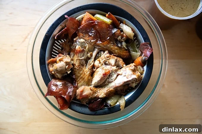 Make Ahead Roasted Turkey Wing Stock 18 The discarded solids from the turkey stock, collected in a strainer over a large bowl, after the rich liquid has been extracted.