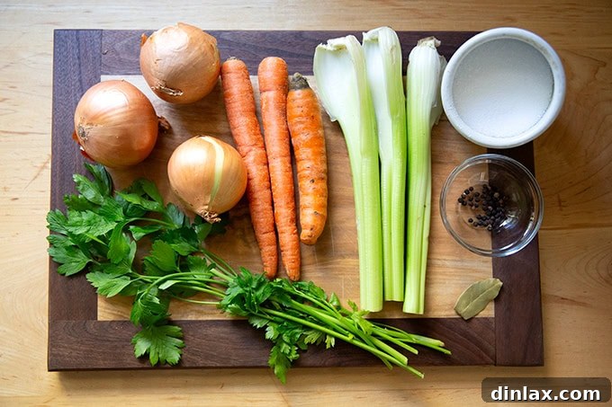 Make Ahead Roasted Turkey Wing Stock 3 The array of essential seasonings for turkey stock: vibrant onions, fresh carrots, crisp celery, fragrant parsley, whole peppercorns, bay leaf, and kosher salt.