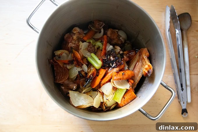 Make Ahead Roasted Turkey Wing Stock 10 The complete set of ingredients — roasted turkey wings and perfectly roasted vegetables — combined in a large pot, ready for stock creation.