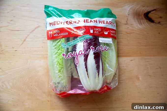 Perfect Caesar Dressing Your Way 3 A sealed bag containing a fresh blend of Romaine lettuce and Treviso radicchio, ready for salad preparation.