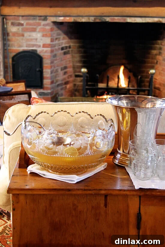 A classic, elegant punch bowl filled with Philadelphia Fish House Punch, ready for serving.