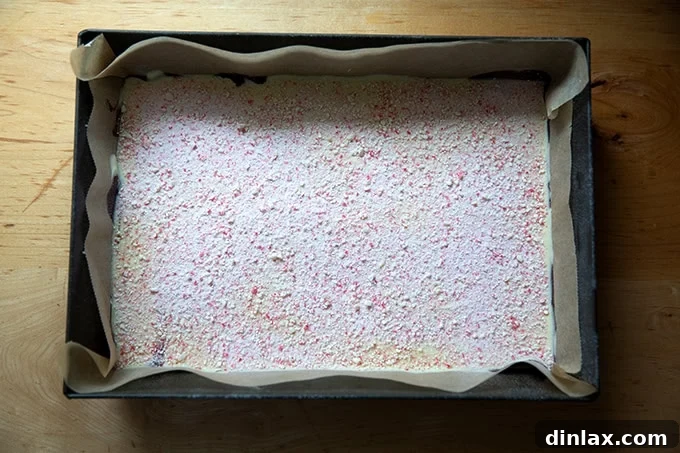 Simple 4-Ingredient Peppermint Bark 14 A 10x14-inch pan filled with peppermint-dusted peppermint bark.