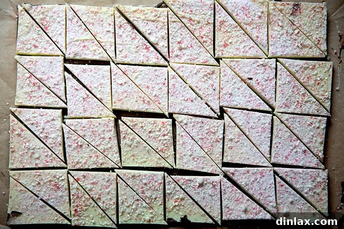 Simple 4-Ingredient Peppermint Bark 19 Peppermint bark cut into triangles.