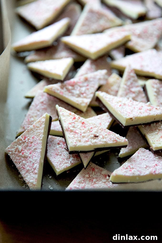 Simple 4-Ingredient Peppermint Bark 21 Peppermint bark cut into triangles in a 10x14-inch pan.