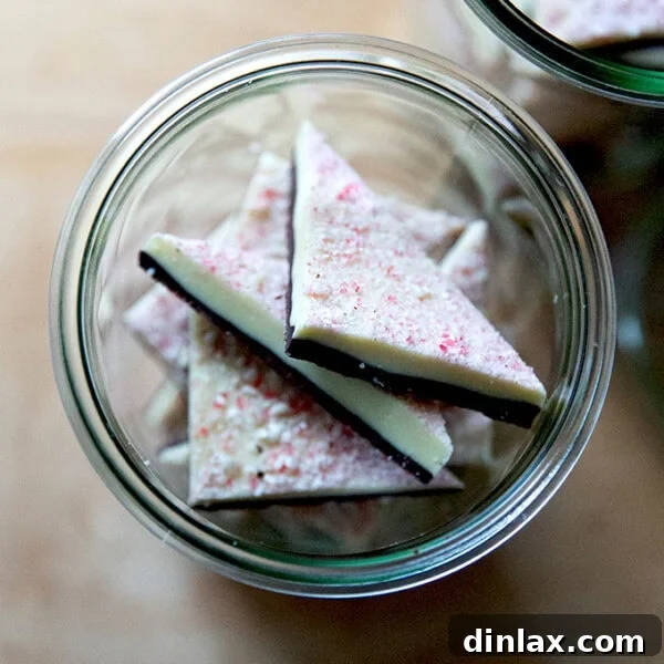 Overhead shot of peppermint bark in glass jars.