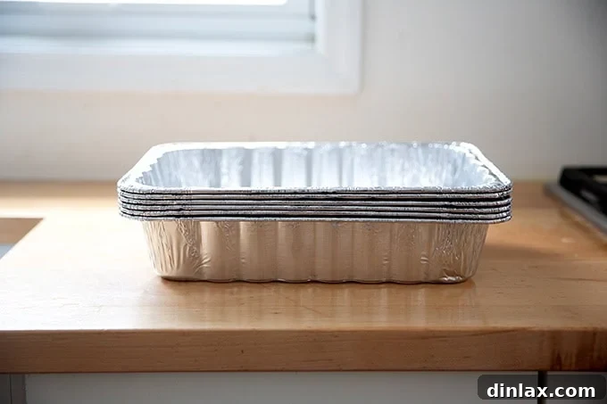 Effortless Baked Pasta: Make It, Share It, Freeze It 19 A stack of disposable aluminum baking pans, perfect for gifting meals.