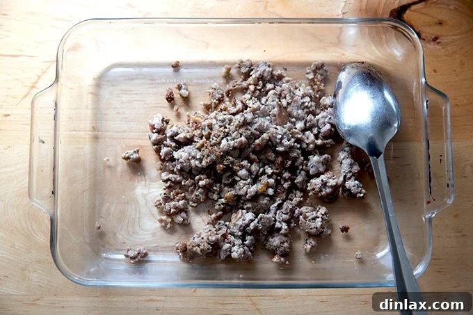 Effortless Baked Pasta: Make It, Share It, Freeze It 10 A 9x13-inch baking pan partially filled with perfectly browned sausage.