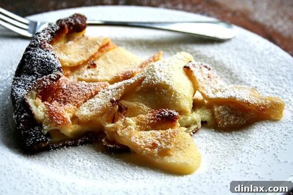 slice of big apple pancake A beautiful slice of the big apple pancake, revealing the tender apples.