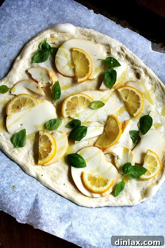 Zesty Lemon, Smoked Mozzarella & Fresh Basil Pizza 5 A lemon pizza, unbaked.