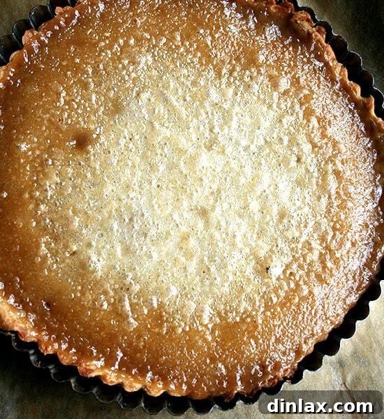 A just-baked maple cream tart, exquisitely golden and ready to be served.