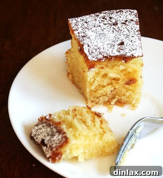 A slice of Chez Panisse almond torte on a plate, elegantly presented and ready to be savored.