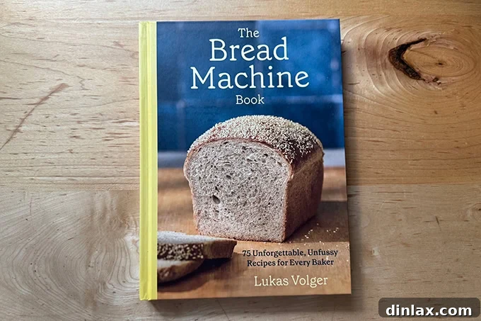 Mother's Day Gift Inspiration 10 The cover of Lukas Volger's The Bread Machine Cookbook, showcasing a freshly baked loaf.