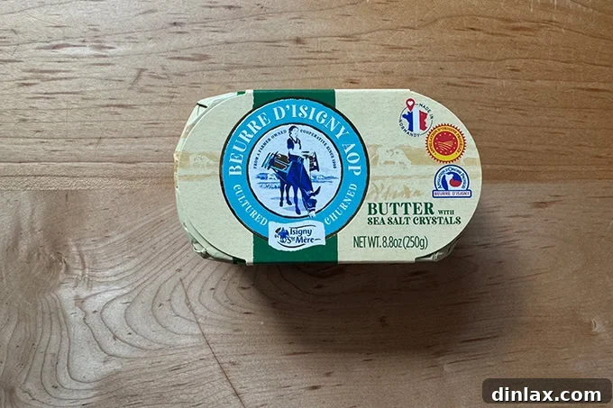 Mother's Day Gift Inspiration 11 A golden block of high-quality butter on a wooden cutting board.