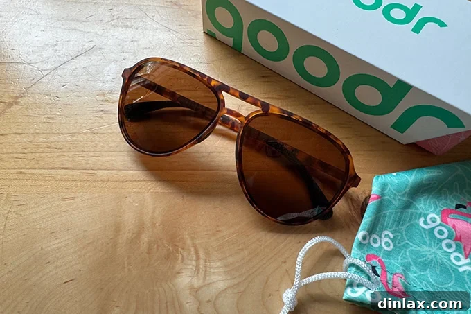 Mother's Day Gift Inspiration 27 A pair of stylish Goodr sunglasses with a reflective lens, placed on a light surface.