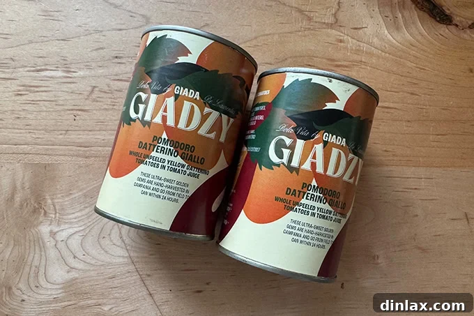 Mother's Day Gift Inspiration 25 Several cans of gourmet yellow tomatoes, stacked neatly.