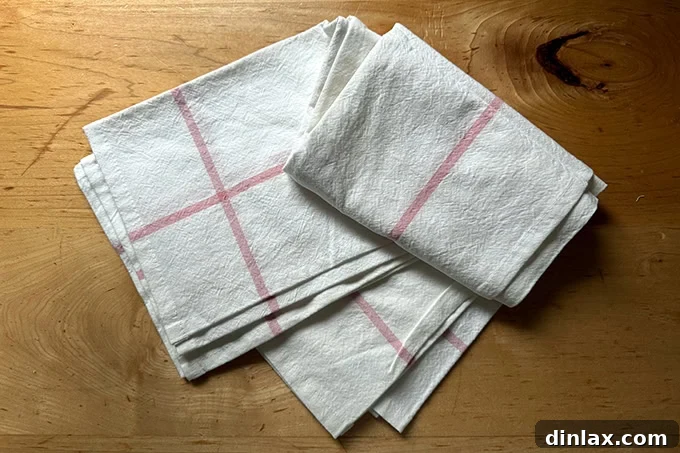 Mother's Day Gift Inspiration 4 A stylish Food52 tea towel draped over a kitchen countertop, ready for use.