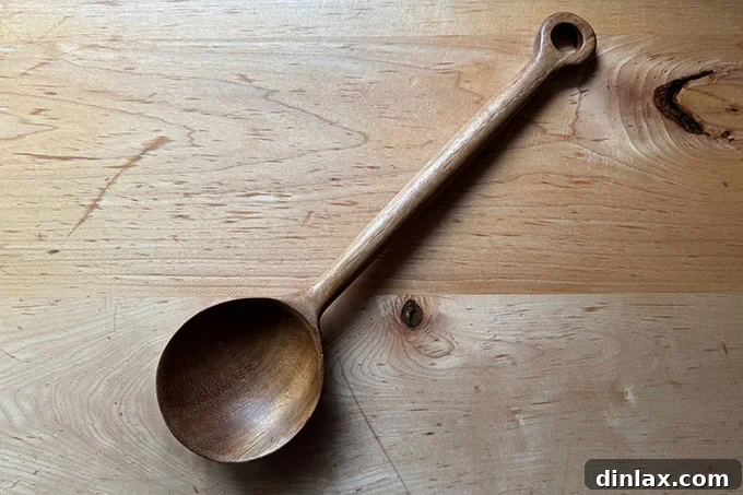 Mother's Day Gift Inspiration 6 A handcrafted wooden bean spoon, ready for cooking.
