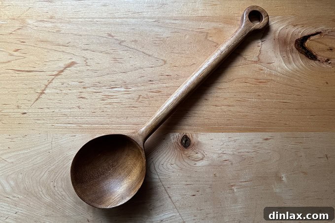 9 Awesome Father's Day Gift Ideas 11 A meticulously carved wooden bean spoon, showcasing its smooth texture and elegant design.