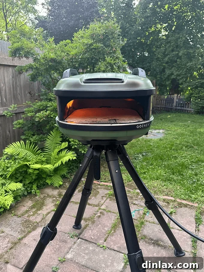9 Awesome Father's Day Gift Ideas 14 The sleek and highly portable Gozney Tread pizza oven, perfectly set up in an outdoor environment, ready for culinary action.