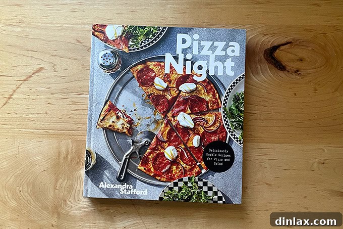 9 Awesome Father's Day Gift Ideas 15 The vibrant and inviting cover of the 'Pizza Night' cookbook, showcasing an irresistible homemade pizza.