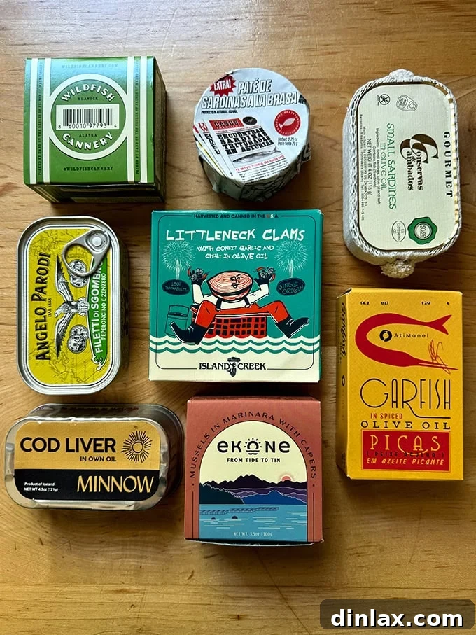 9 Awesome Father's Day Gift Ideas 5 A beautifully arranged assortment of gourmet tinned fish cans, highlighting diverse packaging and premium contents.