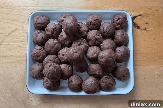 9 Awesome Father's Day Gift Ideas 8 A close-up view of freshly prepared cookie dough balls, showcasing their enticing texture before baking.